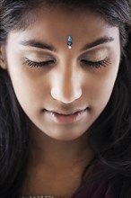 Indian woman with jewel on forehead