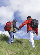 Asian father and son backpacking