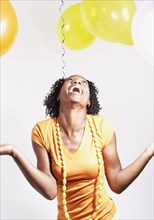 African woman laughing at party