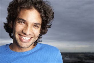 Close up of Hispanic man smiling
