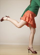 Mixed Race woman wearing mini skirt and high heels