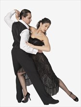 Multi-ethnic couple tango dancing