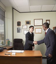 Multi-ethnic businessmen shaking hands