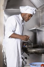 African American male chef preparing food