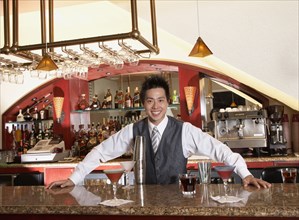 Asian male bartender and cocktails