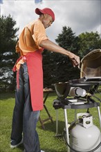 African American man barbecuing