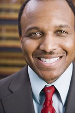 Close up of African American businessman smiling
