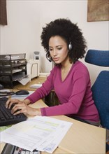 African businesswoman typing on computer