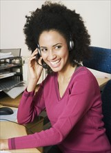 African businesswoman wearing headset