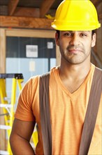Smiling Hispanic construction worker