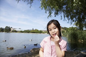 Girl near ducks at park