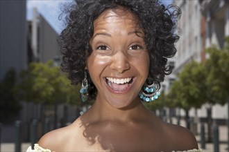 Mixed race woman smiling outdoors