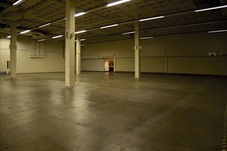 Pillars and lighting in empty warehouse