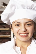 Hispanic baker smiling