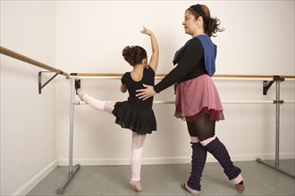 Girl working with ballet teacher