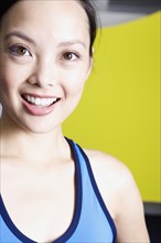Filipino woman smiling in gym