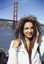 Mixed race woman standing in front of Golden Gate Bridge