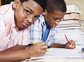 Mixed race boys doing their homework