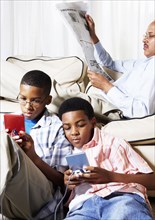 Mixed race boys playing video games