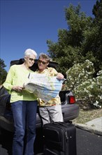 Senior Caucasian couple reading roadmap