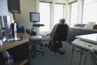 Chair and counters in empty dentist's office