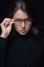Portrait of Hispanic woman wearing eyeglasses