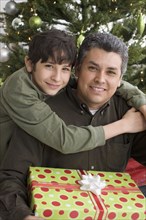 Hispanic father and son on Christmas