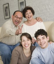 Portrait of Hispanic family being silly