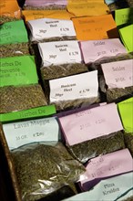 Packages of herbs for sale in market