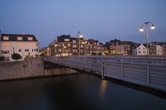 Dutch canal and bridge at night
