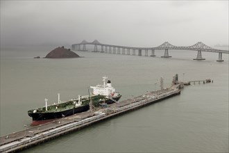 Oil tanker offloading in urban dock