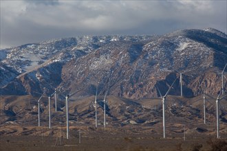 Wind turbines near mountain