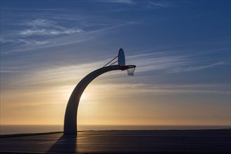 Basketball hoop near ocean