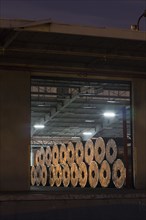 Metal rolls on warehouse loading dock