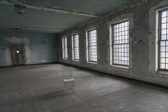 Chair in empty warehouse
