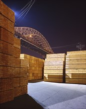 Piles of lumber at night