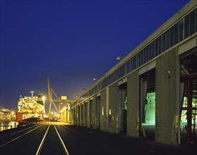 Railroad tracks at harbor at night