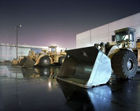 Bulldozers in parking lot