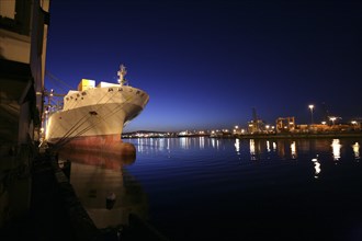 Freighter in port at night