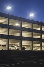 Cars in parking garage at night