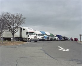 Row of parked semi-trucks