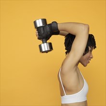 African woman lifting weights