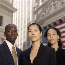 Portrait of businesspeople in front of American flag