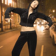 Asian woman posing in street