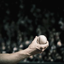 Caucasian baseball player holding ball