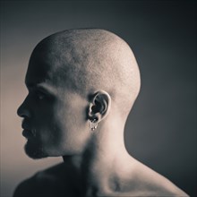 Silhouette of man wearing earrings