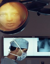 Image of woman over surgeon in operating room