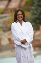 African woman wearing spa bathrobe