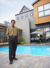 Man standing on patio of house