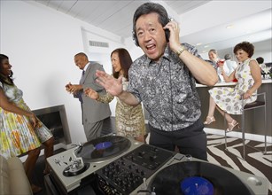 Asian DJ performing at party